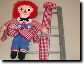 Country handmade doll Raggedy Andy.